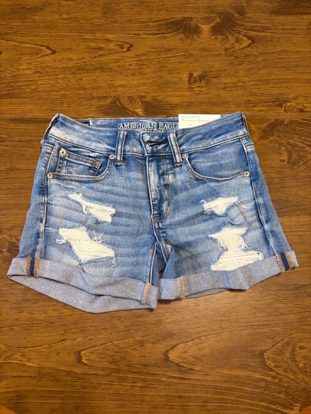 American Eagle Outfitters Distressed Denim Shorts with lace inlay pockets